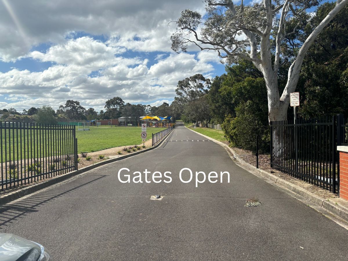 Open entrance gates at Holy Saviour Tennis Club, Vermont South, during coaching hours