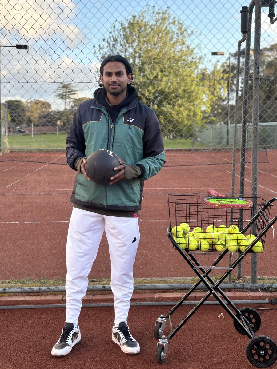 Kishen Reddy, Club Professional Coach at Temp Tennis, on the clay courts at Holy Saviour Tennis Club